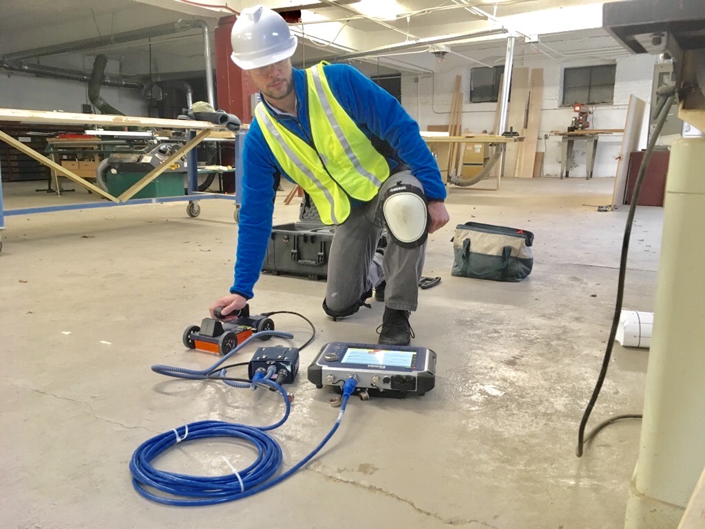 GPR Services technician performing ground penetration radar scanning to repair cracked concrete